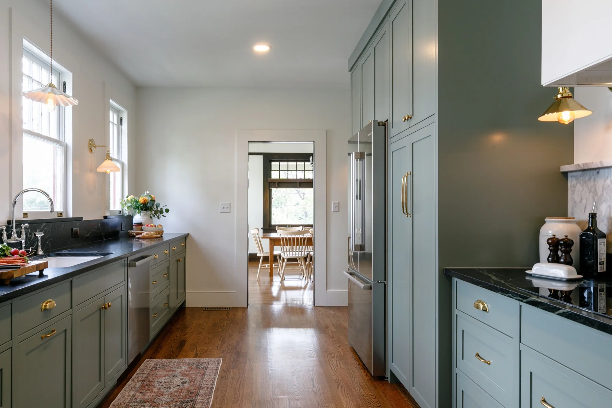 Renovated kitchen with sage green cabinetry and brass fixtures, Montford, Asheville